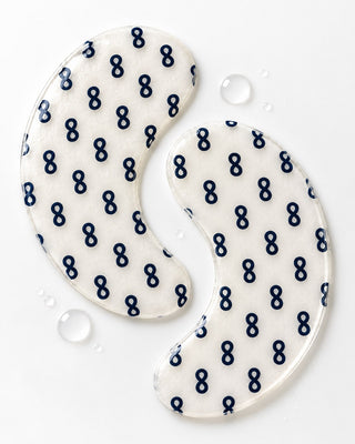 Single pair of GHK-Cu hydrogel eye patches with water droplets, macro